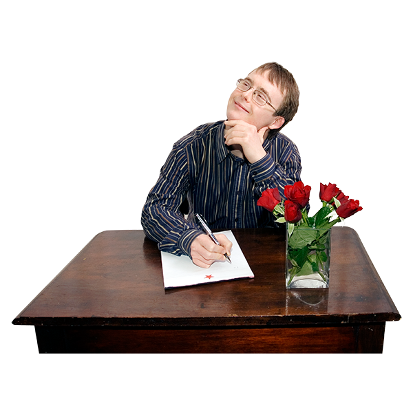 A picture of a young man sitting at a table witing a letter